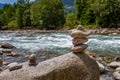 Harmony, balance and simplicity concept. A stone pyramid with a river in the background Royalty Free Stock Photo