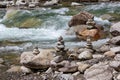 Harmony, balance and simplicity concept. A stone pyramid with a river in the background Royalty Free Stock Photo