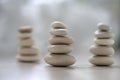 Harmony and balance, three cairns, simple poise pebbles on wooden light white gray background, simplicity rock zen sculpture Royalty Free Stock Photo