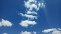The harmony of the colors of the bright white clouds and the clear blue sky in the summer Royalty Free Stock Photo