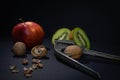 Harmony in Diversity: Apple, Kiwi, Cracked Nut, and Hammer Royalty Free Stock Photo