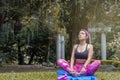 Harmony with the elements: woman performing yoga poses in the open air Royalty Free Stock Photo