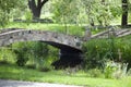 In harmony with nature. Landscape park. Stone bridge on summer landscape. Old stone bridge in botanical garden. Landscape Royalty Free Stock Photo