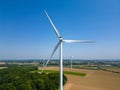 Harnessing the Breeze: Wind Turbine in Rural Landscape Royalty Free Stock Photo