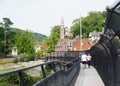 Harpers Ferry, West Virginia, U.S.A - August 22, 2021 - The Appalachian Trail Bridge with visitors on a summer day