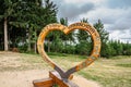 Harrachov,Czech Republic-August 13,2022. Photo frame with wooden heart and sign Hello from Harrachov.Certova hora,Krkonose