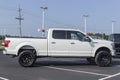 Ford F-150 display at a dealership. The Ford F150 is available in XL, XLT, Lariat, King Ranch, Platinum, and Limited models Royalty Free Stock Photo