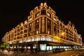 Harrods department store in London at night