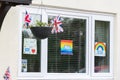 HARROW, UNITED KINGDOM - May 09, 2020: Children\'s drawing on house window with positive messages for the NHS workers during the