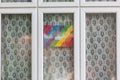 HARROW, UNITED KINGDOM - May 09, 2020: Children\'s drawing on house window with positive messages for the NHS workers during the