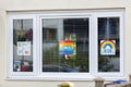 HARROW, UNITED KINGDOM - May 09, 2020: Children\'s drawing on house window with positive messages for the NHS workers during the