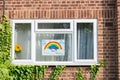 HARROW, UNITED KINGDOM - May 09, 2020: Children\'s drawing on house window with positive messages for the NHS workers during the