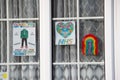 HARROW, UNITED KINGDOM - May 09, 2020: Children\'s drawing on house window with positive messages for the NHS workers during the