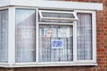 HARROW, UNITED KINGDOM - May 09, 2020: Children\'s drawing on house window with positive messages for the NHS workers during the