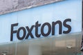 HARROW, UNITED KINGDOM - May 09, 2020: Logo of real estate agent Foxtons on the front of a store