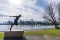 Harry Jerome Statue and Vancouver City skyline in the background. Beautiful cityscape seen from Stanley Park.