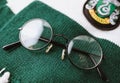 Harry Potter glasses on slytherin faculty scarf Royalty Free Stock Photo