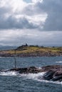 Harsh sea at Mortavika and the weather or radar station on the small hill, Norway Royalty Free Stock Photo