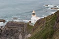 Hartland Point Lighthouse sitting on rocks at Devon`s coastline Royalty Free Stock Photo