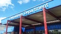 Entrance to Outpatients Department at healthcare hospital building showing sign