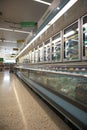 Supermarket display of frozen food for purchase in freezers