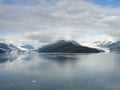 Harvard Glacier at the end of College Fjord Alaska. Wide glacier carving its path to the sea. Mountains peaks water and clouds Royalty Free Stock Photo