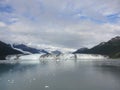 Harvard Glacier at the end of College Fjord Alaska. Wide glacier carving its path to the sea. Mountains peaks water and clouds Royalty Free Stock Photo