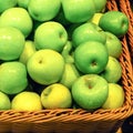 Harvest apples in boxes. Apple background. Beautiful green apples closeup. Fruits for healthy eating
