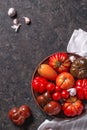 The harvest of assorted tomatoes. Colorful organic tomatoes on a large dish