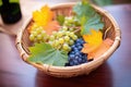 harvest basket full of tempranillo grapes, vine leaves Royalty Free Stock Photo