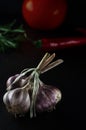 Harvest. A bunch of garlic lies on a black background close-up Royalty Free Stock Photo