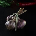 Harvest. A bunch of garlic lies on a black background close-up Royalty Free Stock Photo