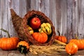 Harvest cornucopia on a rustic wood background Royalty Free Stock Photo