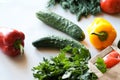 Top view of vegetables and greens with wooden cutting board. Healthy food background Royalty Free Stock Photo