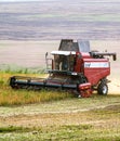 Harvester combine autumn graine wheat farmer worker plantation technology green field