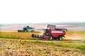 Harvester combine autumn graine wheat farmer worker plantation technology green field