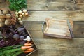 Harvest fresh vegetables from carrot, beetroot, onion, garlic on old wooden board. Top view. Gardening. Copy space. Royalty Free Stock Photo