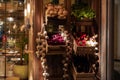 Harvest of fresh vegetables in wooden crates against dark wooden wall