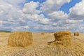 Harvest landscape with straw bales amongst fields in autumn Royalty Free Stock Photo