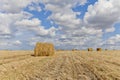 Harvest landscape with straw bales amongst fields in autumn Royalty Free Stock Photo