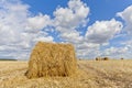 Harvest landscape with straw bales amongst fields in autumn Royalty Free Stock Photo