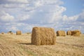 Harvest landscape with straw bales amongst fields in autumn Royalty Free Stock Photo