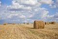 Harvest landscape with straw bales amongst fields in autumn Royalty Free Stock Photo