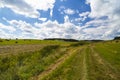 A harvest landscape vista in rolling hills in Romania with round Royalty Free Stock Photo