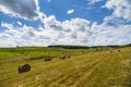 A harvest landscape vista in rolling hills in Romania with round Royalty Free Stock Photo