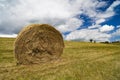 A harvest landscape vista in rolling hills in Romania with round Royalty Free Stock Photo