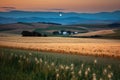 harvest moon shining over rolling hills and crops