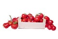 Harvest red ripe tomatoes in wooden box