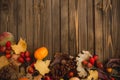 Harvest or Thanksgiving background with autumnal fruits and gourds on rustic wooden table Royalty Free Stock Photo