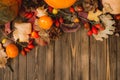 Harvest or Thanksgiving background with autumnal fruits and gourds on rustic wooden table Royalty Free Stock Photo